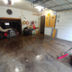 After the initial hose out but before pressure washing